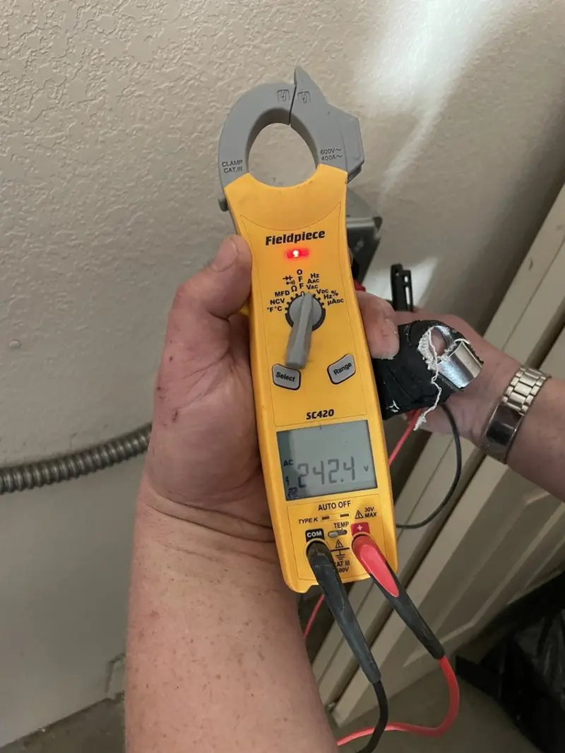 Voltage testing with clamp meter during Ceiling Fan Installation in Credit River